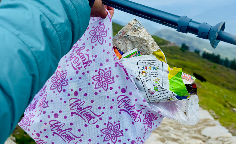 Plastic waste being collected in reusable bags as part of eco-friendly travel effort