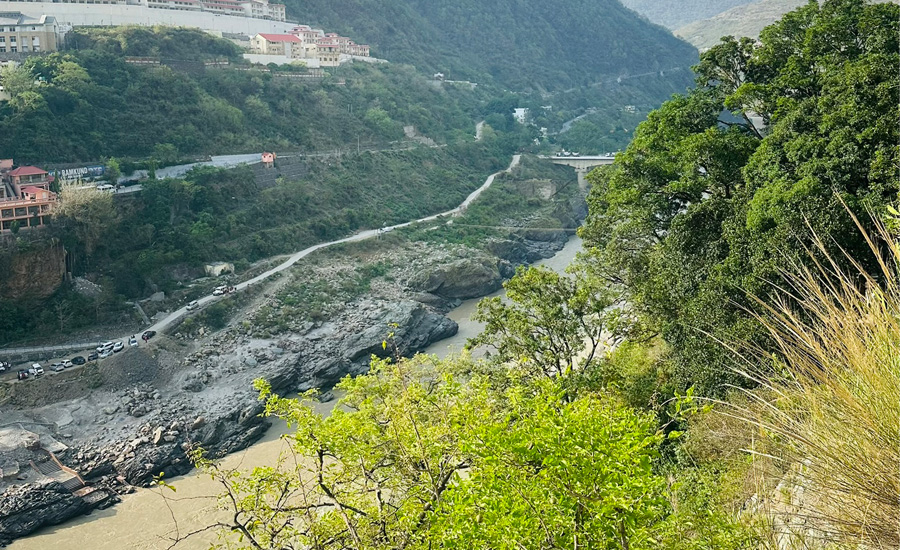 Crystal-clear river gracefully flowing through the majestic Himalayan mountains—nature in perfect harmony
