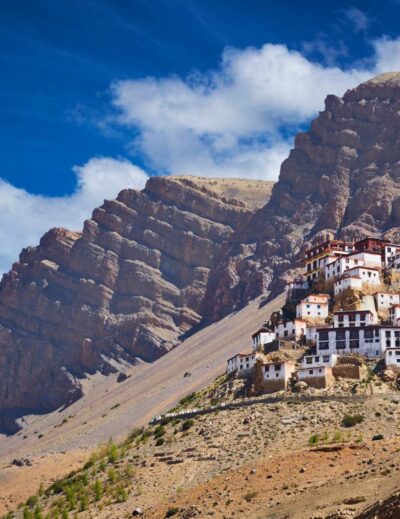 Backpacker standing on mountain roads in Spiti Valley, Himachal Pradesh – budget travel guide