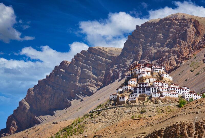 Backpacker standing on mountain roads in Spiti Valley, Himachal Pradesh – budget travel guide