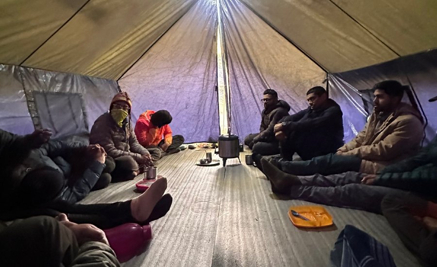 Community tent at Kanamo Base Camp where trekkers gathered every evening