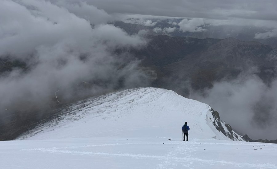 Descending through deep snow from the Kanamo Peak summit