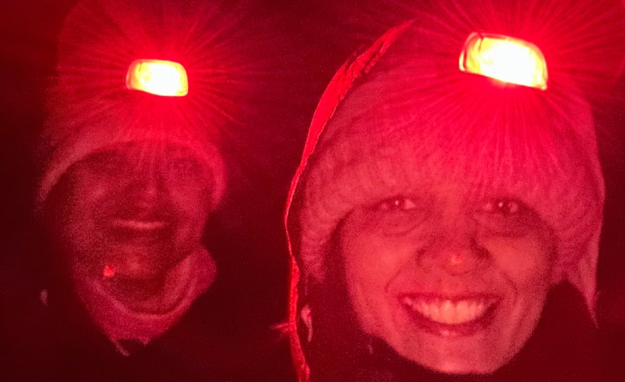 Headlamps illuminating the Kanamo Peak summit trail before sunrise