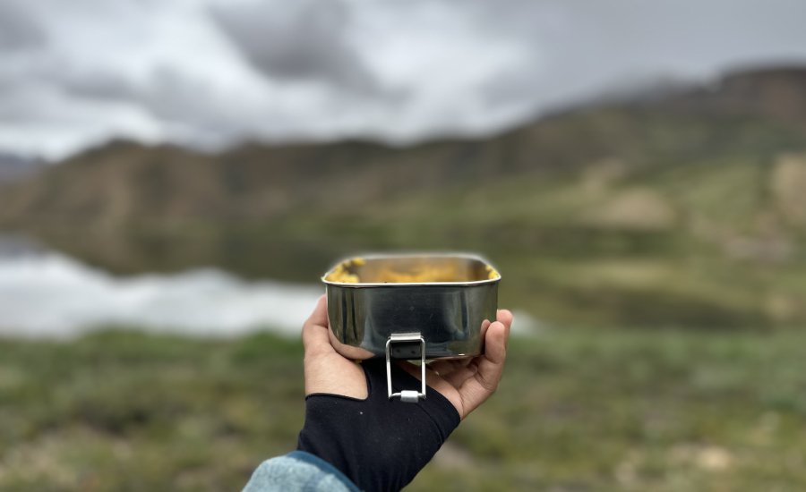 Lunch beside a beautiful alpine lake on the Kanamo Base Camp trek
